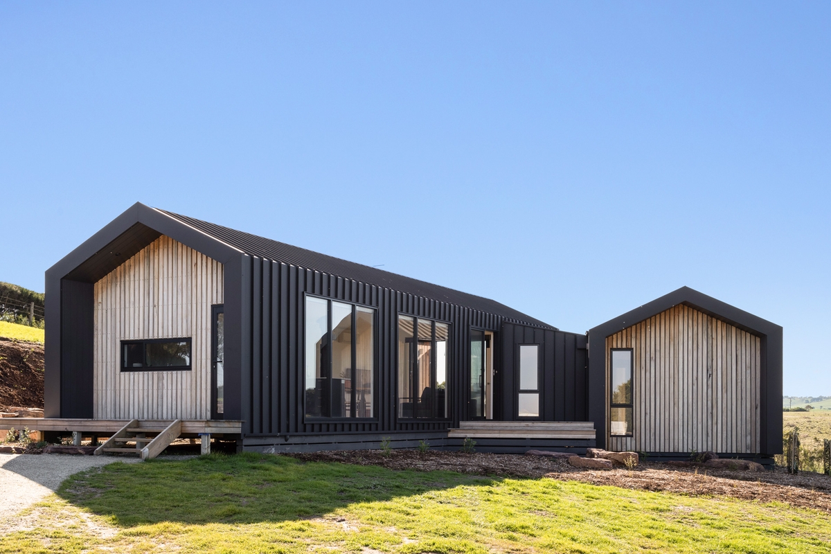 Our Kilcunda project features Colorbond Enseam in matt Monument and silvertop ash battens.